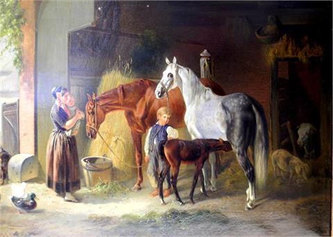 Frau mit Kindern im Pferdestall